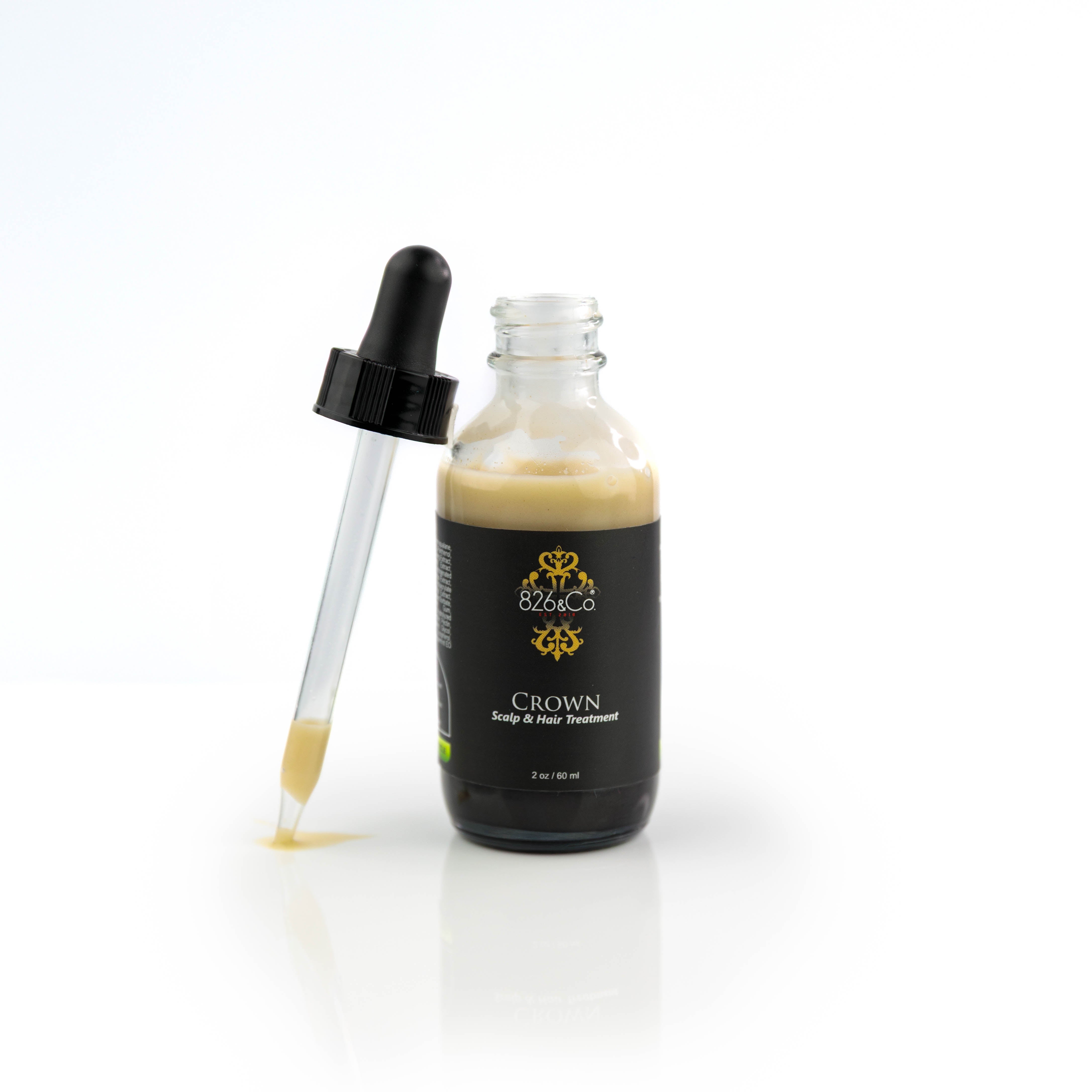 This image features a sleek, dark glass bottle with a dropper applicator, containing a beige-colored serum. 